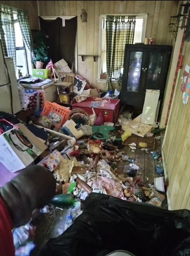 Room filled with accumulated junk before an R&J property cleanup
